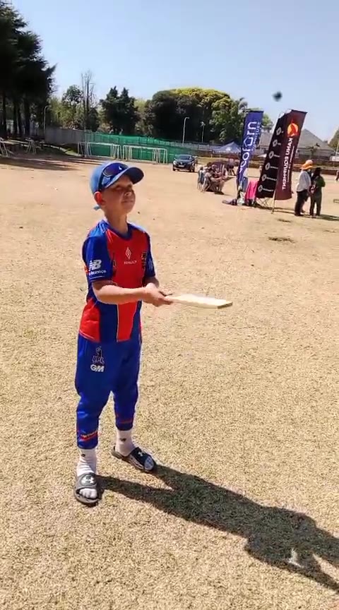 A young player in club colours batting with a KiTi-Bat at a tournament
