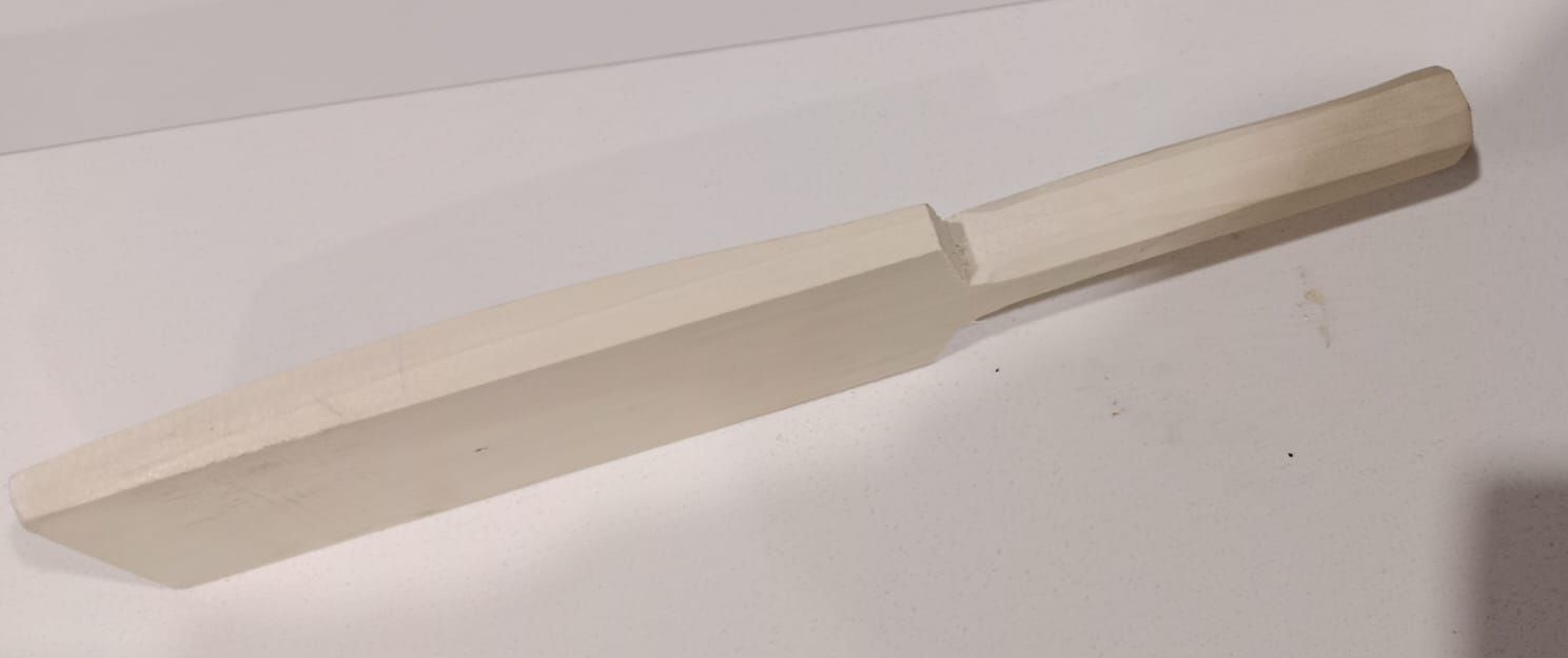 A shaped bat blank, rounded and tapered by hand