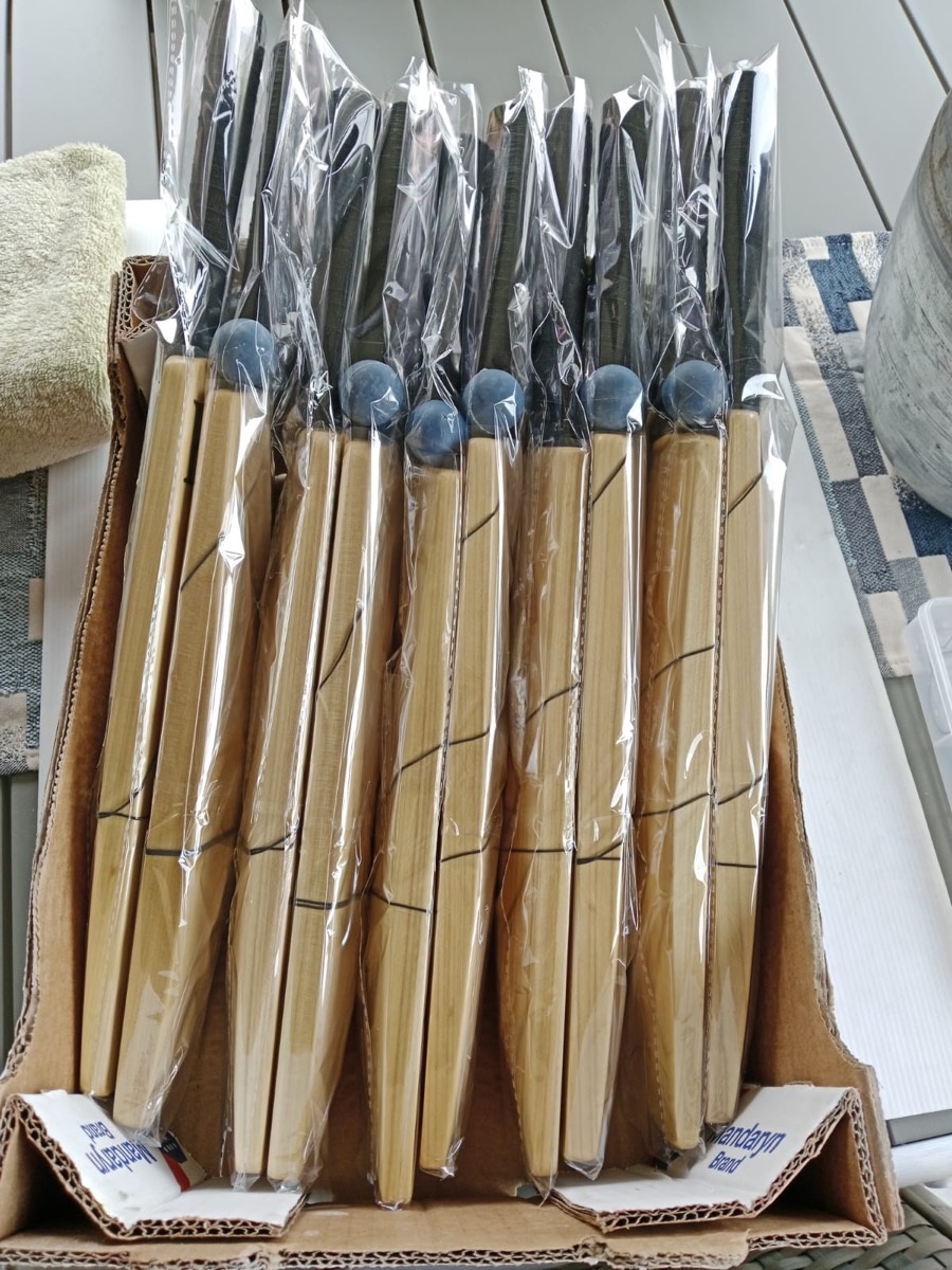 KiTi-Bats packed in a box, each with its rubber ball and elastic cord attached