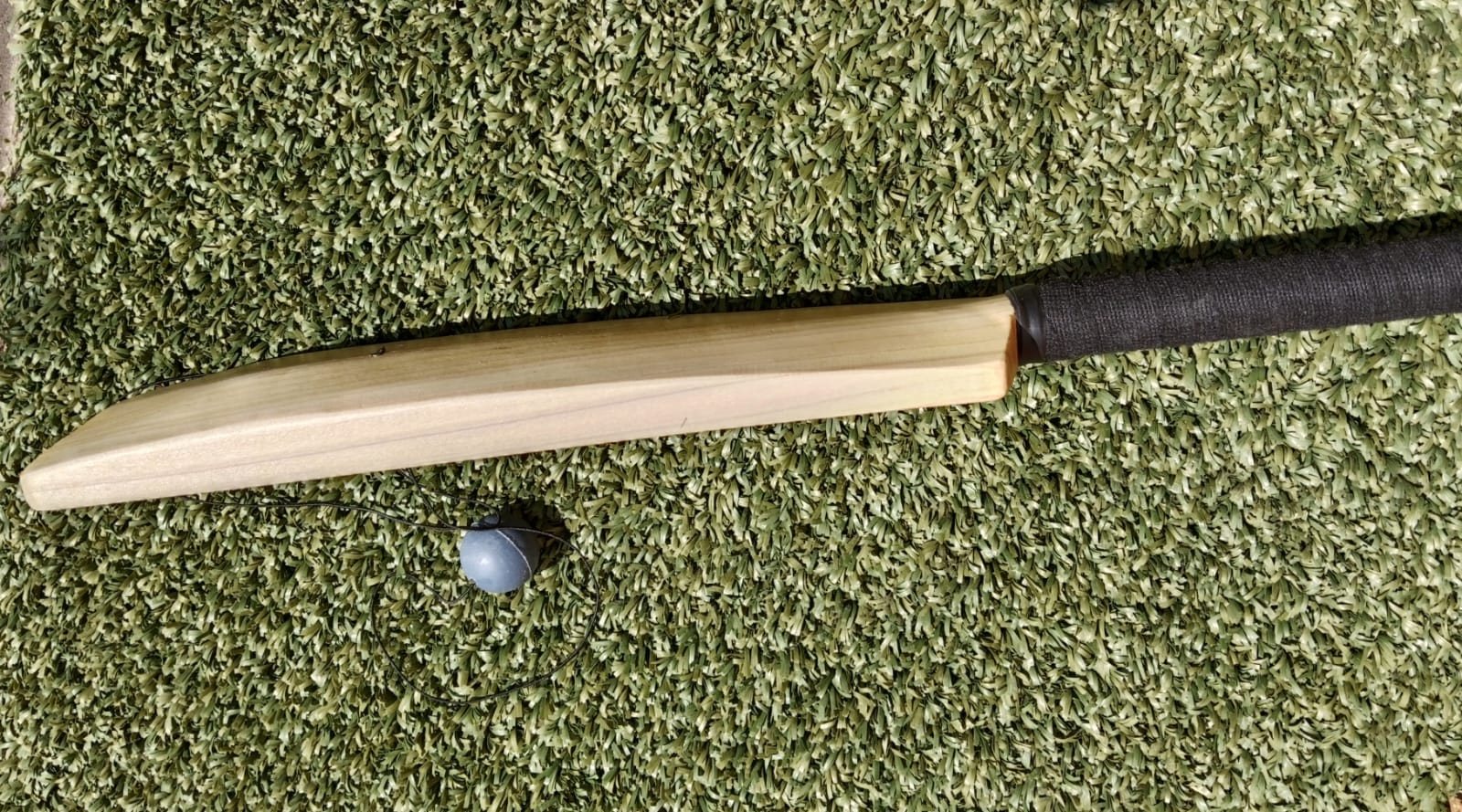 A KiTi-Bat seen edge on, showing how narrow the face is