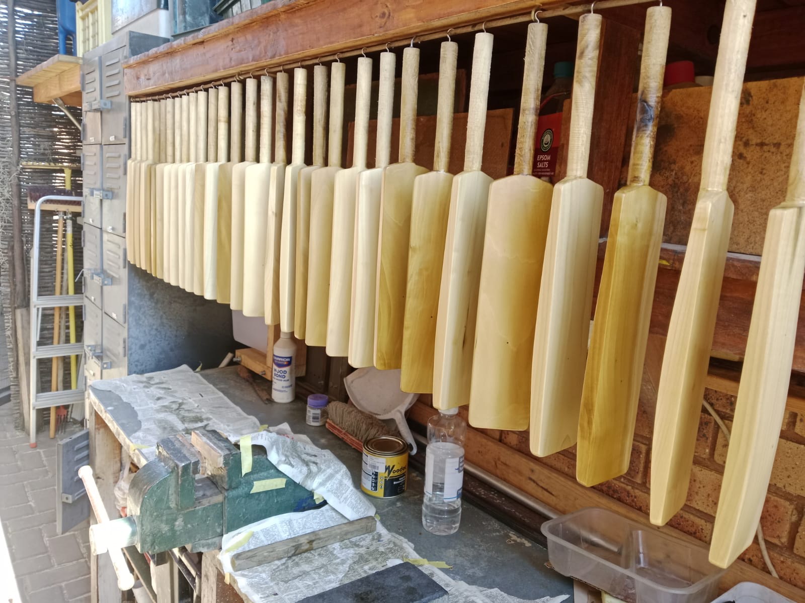 Rows of finished KiTi-Bats hanging in the workshop
